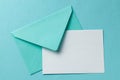 Green envelope and blank letter on green background. Template with place for text on postcard. mock-up Royalty Free Stock Photo
