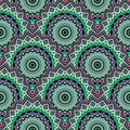 Green ethnic tiled mandalas seamless pattern. Colorful tribal background. Floral round bohemian ornaments. Geometric