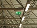 Green Exit Sign under Grid Roof with Lamps