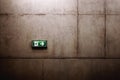 Green exit sign on the wall