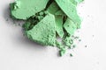 Green eye shadow powder as makeup palette closeup isolated on white background, crushed cosmetics and beauty texture Royalty Free Stock Photo