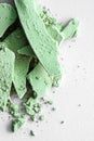 Green eye shadow powder as makeup palette closeup isolated on white background, crushed cosmetics and beauty texture Royalty Free Stock Photo