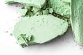 Green eye shadow powder as makeup palette closeup isolated on white background, crushed cosmetics and beauty texture Royalty Free Stock Photo