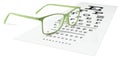 green eyeglasses on visual test chart isolated on white. Eyesight concept Royalty Free Stock Photo