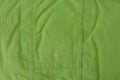 Green fabric texture from a piece of crumpled old clothes Royalty Free Stock Photo