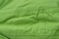 Green fabric texture from a piece of crumpled old clothes Royalty Free Stock Photo