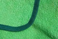 Green fabric texture from a piece of wool fabric with a seam Royalty Free Stock Photo