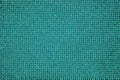 Green fabric, threads woven close-up, background wallpaper, uniform texture pattern