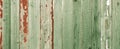 Green Faded Wooden Fence. Old Weathered Wood Planks. Rustic Aged Surface. Panoramic Photo Royalty Free Stock Photo
