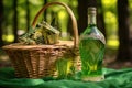 green fairy absinthe bottle in a picnic basket
