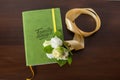 Green family diary with leather cover.