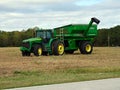 Green farm tractor in a cotton field Royalty Free Stock Photo