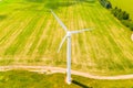 Green farmland concept. Wind turbine in rural area. Aerial landscape Royalty Free Stock Photo
