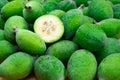 Green feijoa fruit cut Acca sellowiana. Raw acca sellowiana plant, guavasteen green fruit