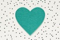 Green felt heart confetti background. Love romance symbol Royalty Free Stock Photo