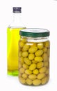 Green fermented olives preserved in bank on a white background Royalty Free Stock Photo