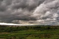 Green field amond amazing cloudy rainy sky