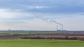 Green field on the background of urban industrial zone Royalty Free Stock Photo