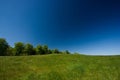 Green field and blue sky