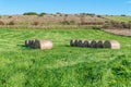 A green field with hay bales and blue sky Royalty Free Stock Photo