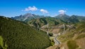 Green grassland, mountains, blue sky and white clouds