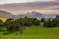 Green field and view of Trzy Korony, Pieniny Mountains Peak in Poland at Spring. Royalty Free Stock Photo