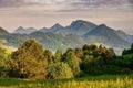 Green field and view of Trzy Korony, Pieniny Mountains Peak in Poland at Spring. Royalty Free Stock Photo