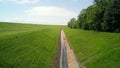 Green field and water road