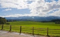 Green field with wooden fence in Bavaria