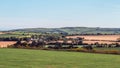 Green fields and hills in the evening in Ireland. Irish rural landscape, agricultural land. Green grass field near green trees Royalty Free Stock Photo