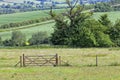 English countryside in summer, with farm fields, meadows, entrance gate . Royalty Free Stock Photo