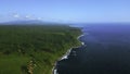 Green fields, meadows, summer blue sky and calm sea. Clip. Picturesque countryside marine landscape with green forested Royalty Free Stock Photo