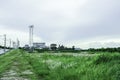 Green fields with modern factory buidling for green industry concept