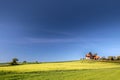 Green fields by the Ruts Kirke church on Bornholm