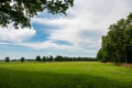 Green fields, trees and clouds at the Dutch countryside around Elsloo Royalty Free Stock Photo