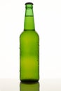 Green filled beer bottle.