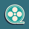 Green Film reel icon isolated on green background. Long shadow style. Vector