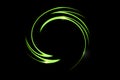 Green fire comet light flying in circle. Shining lights in motion with particles on black sky. Ring of fire, abstract background Royalty Free Stock Photo