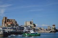 Green Fishing Boat In Front Of The Roman Bridge The Hermitage And Castle Of Santa Ana And The Church Of The Assumption On The