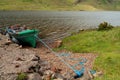 Green fishing boat on a lake. Outdoor activity. Calm water with light waves. Connemara, Ireland Royalty Free Stock Photo