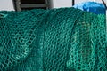 Green fishing trawl ned on a fishing boat.. Royalty Free Stock Photo