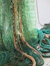 Green fishing trawl net in a trawler boat