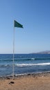 Green flag on the beach released for swimming