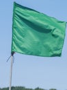 Green flag on coastal background Royalty Free Stock Photo