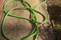 Green flexible hose for watering garden. Water supply