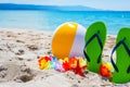 Green flip flops and beach ball Royalty Free Stock Photo