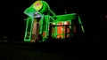 Green fluorescent flower store with neon sign