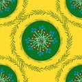 Green folk ornament on a yellow color