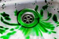 Green Food Coloring Going Down A Sink Drain Royalty Free Stock Photo