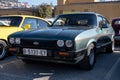 Green Ford Capri sports car parked outside